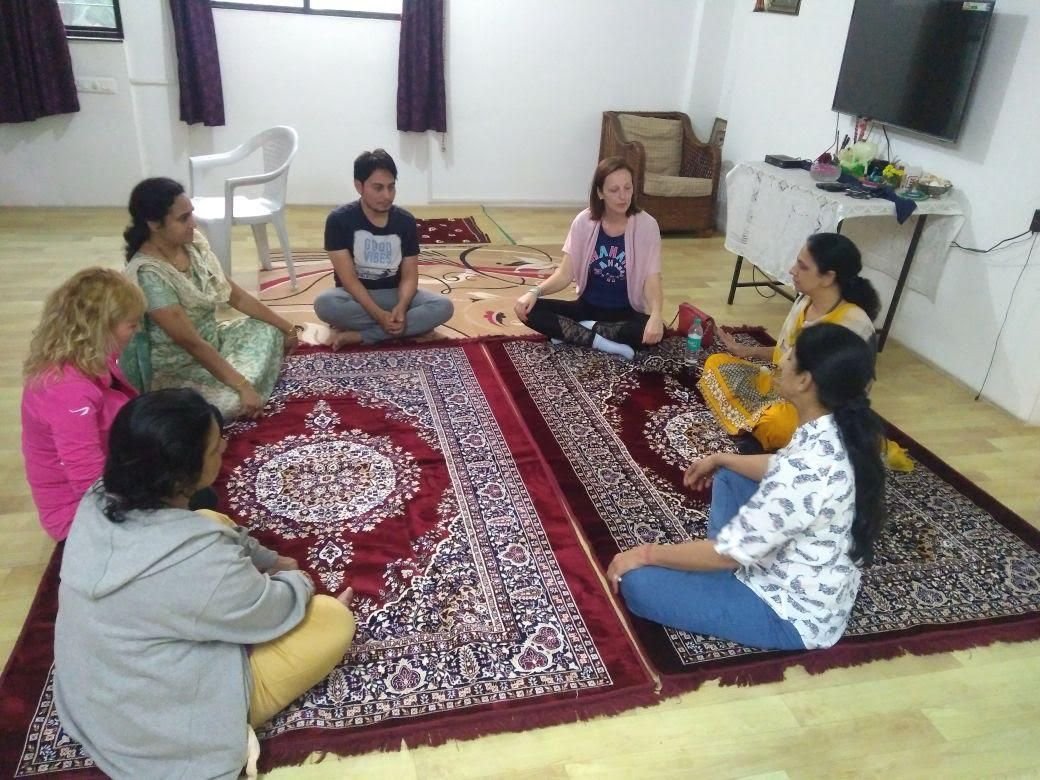 A group seated in a meditation circle