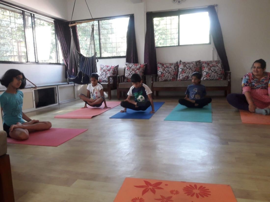 A yoga session with students of different ages